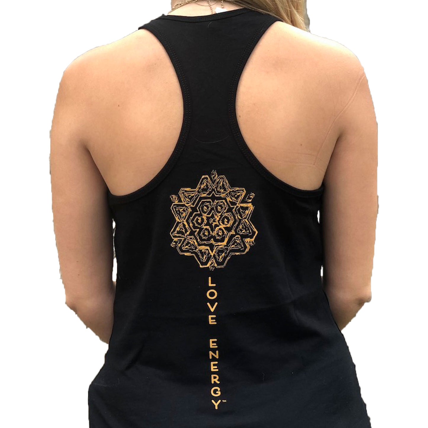 On the back of a black racer back tank top, a unique bronze mandala sits above the words Love Energy that run down the spine. The words Love Energy are on the front left chest. 
